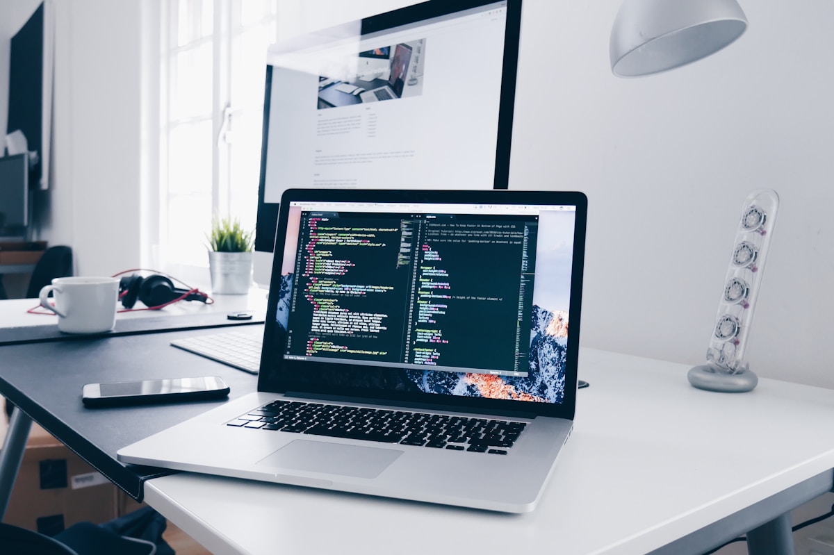 Custom website layouts on a laptop and desktop, representing a branded WordPress site build