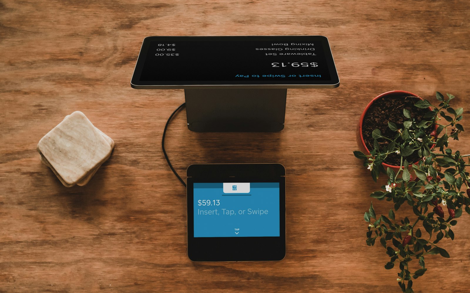Point-of-sale terminal totaling a product order, representing hired WooCommerce specialists