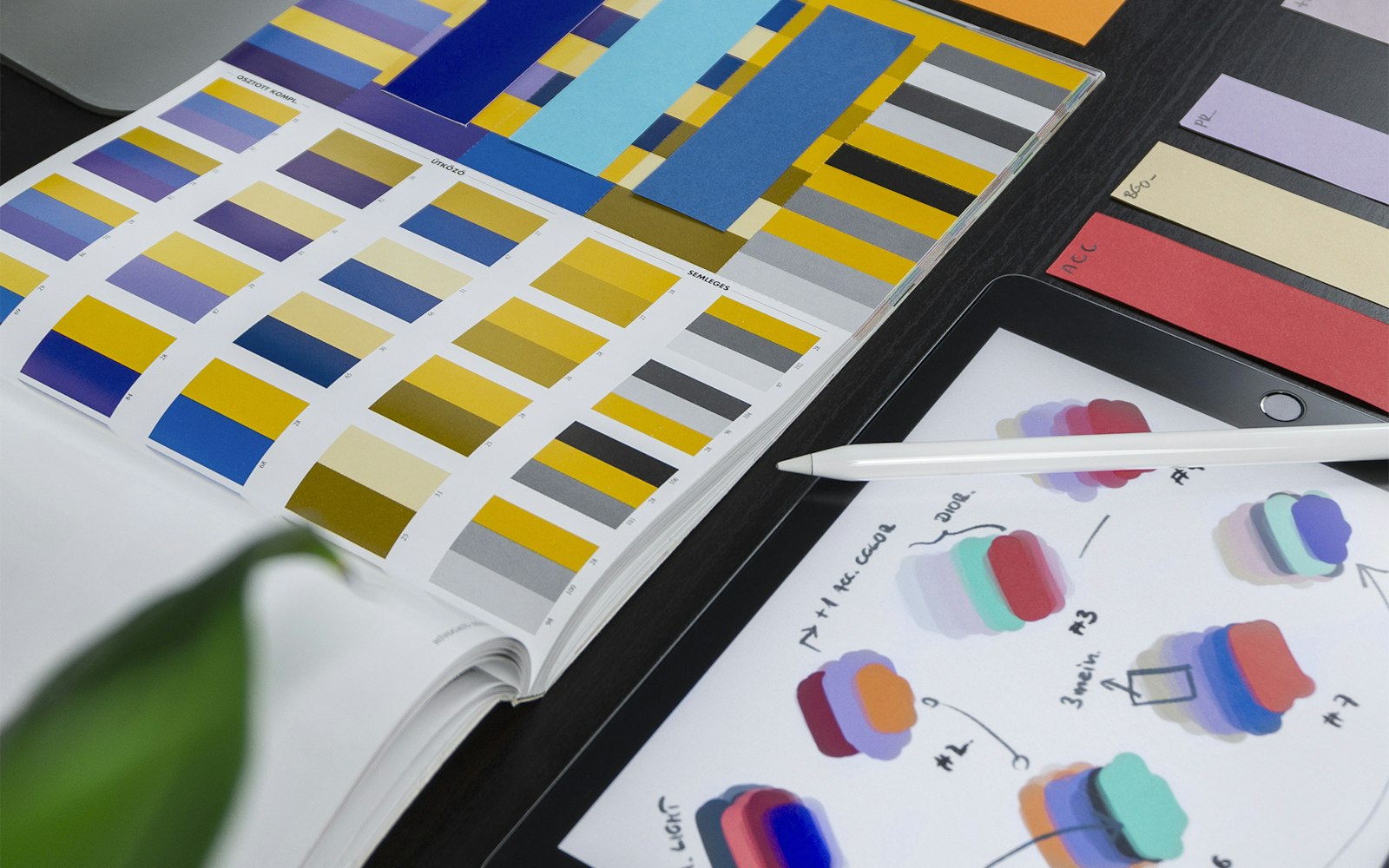 Color swatches and UI sketches on a tablet, representing WordPress theme and block customization